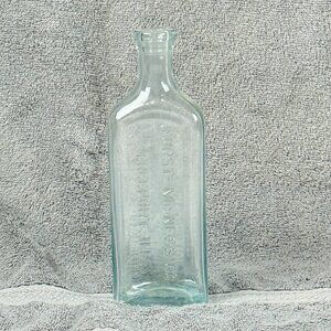 Furst McNess Co Freeport IL Antique Clear Glass Bottle Embossed Logo 8" High